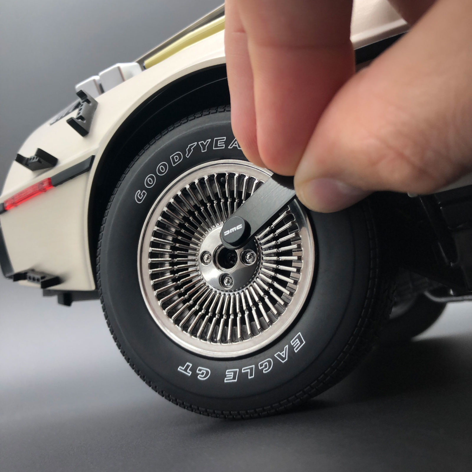 Removing DeLorean Magnetic Wheel Caps using magnetic tab