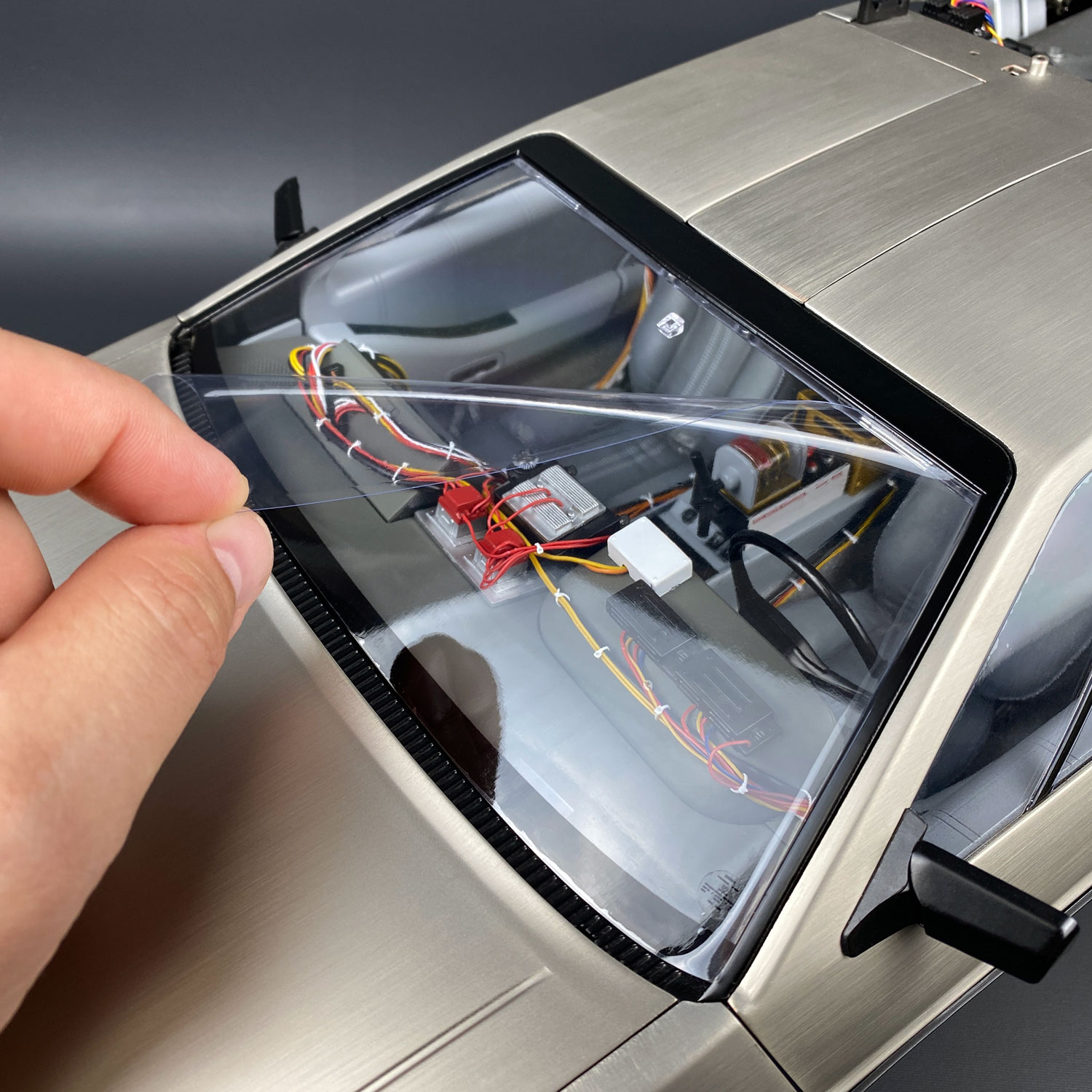 Applying Static Cling Window Protector to Eaglemoss DeLorean
