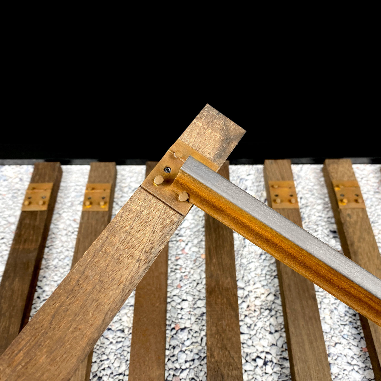 Sliding rail into railroad tie plate