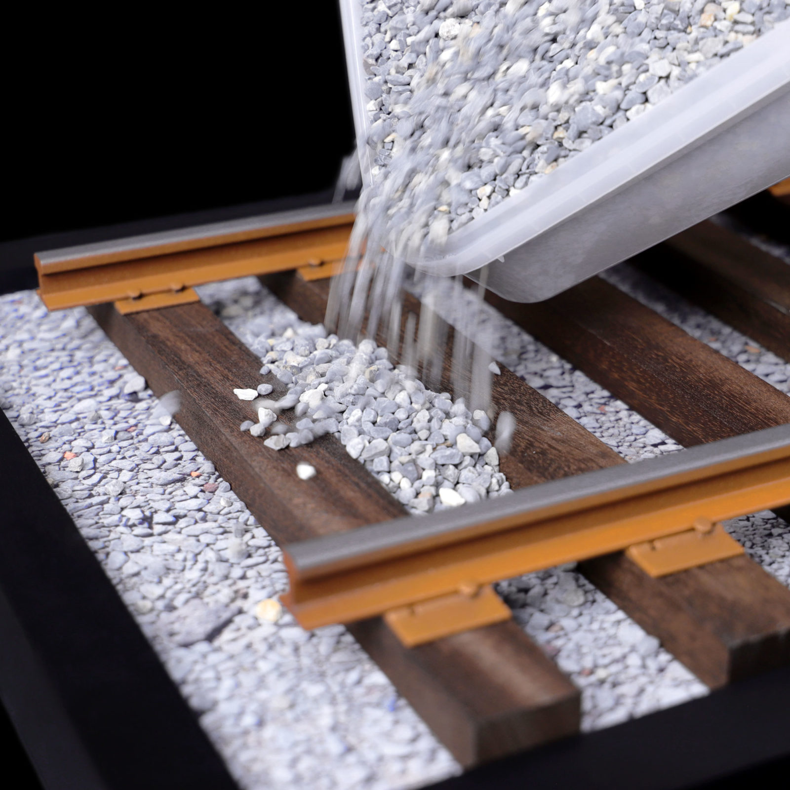 Pouring stone mix between tracks of DeLorean Railroad mod